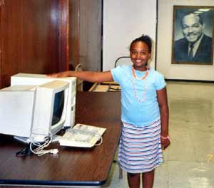 Ebony Owens with a new computer in the Lab