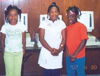 Proud graduates and new computer owners