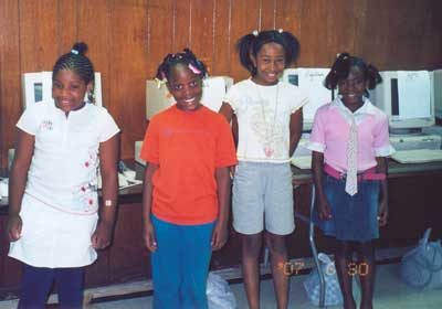 Proud graduates and new computer owners